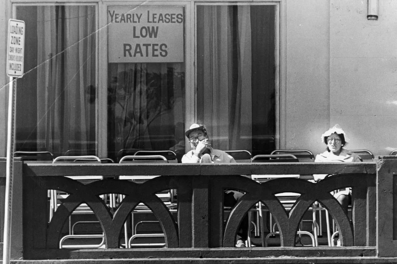 Folks sit outside of a hotel on Miami Beach. 